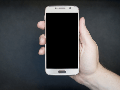 Picture of a hand and cell phone